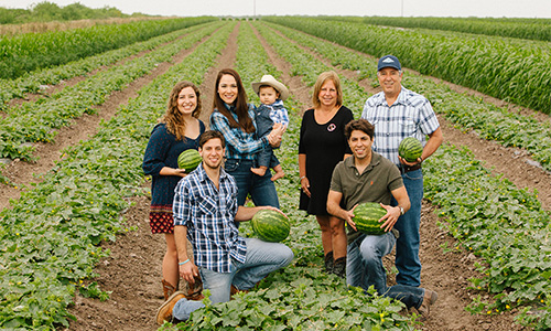 family photo taken in a field